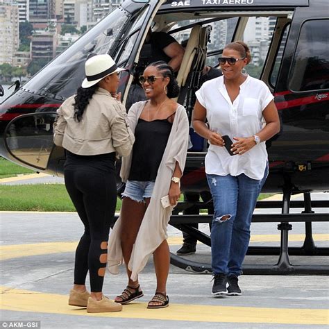 queen latifah in rio de janeiro with eboni nichols and enjoys beer with