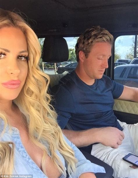 kim zolciak lashes out at haters with small boobs