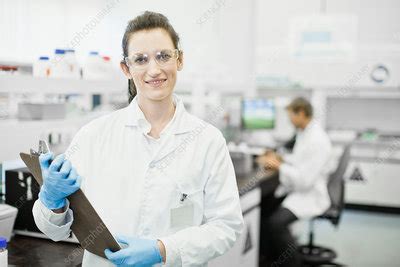 scientist holding clipboard  lab stock image  science
