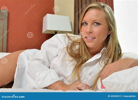 blonde woman wearing only men s shirt bedroom stock image image