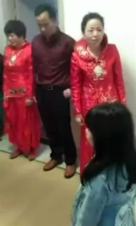 groom filmed with two brides either side of him as he