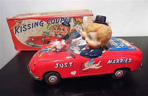 vintage tinplate battery operated kissing couple in car