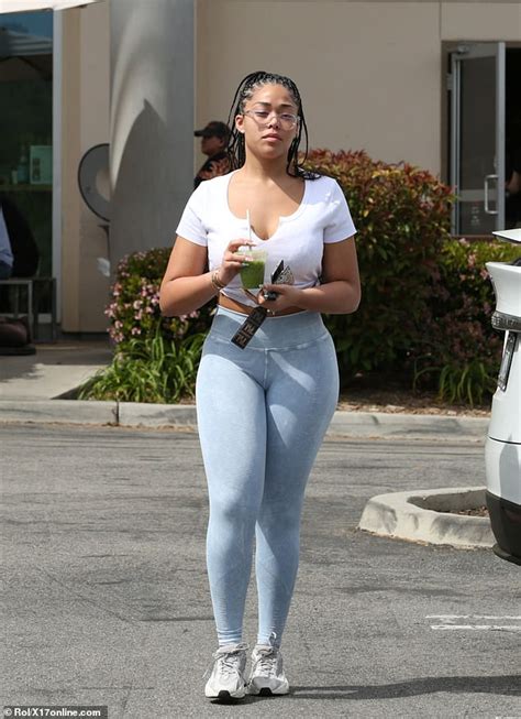 Jordyn Woods Showcases Her Famous Curves In Plunging Tee And Skintight
