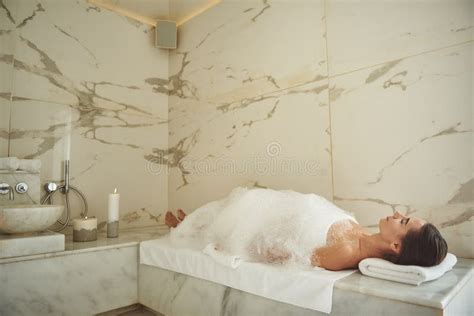 Peaceful Woman Covered With Soap Foam Relaxing In Turkish Bath Stock