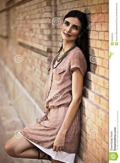 Beatiful Woman Leaning Against A Brick Wall Stock Image Image Of