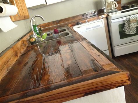 glossy reclaimed wood countertop stainless steel divided kitchen sink