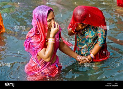 two women taking bath at har ki pauri ghat the famous bathing ghat in