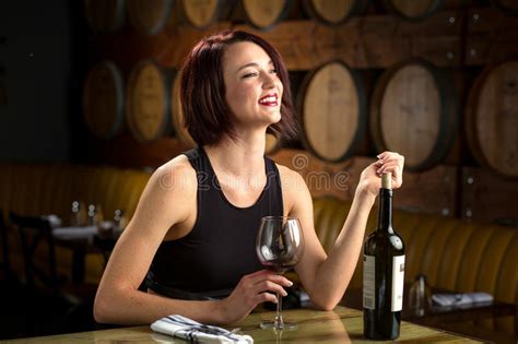 Lady Holds Glass Of Wine For Cheers Toast At A Dinner