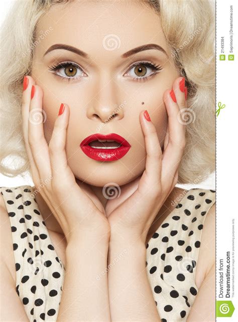 sexy pin up girl with retro make up red manicure stock