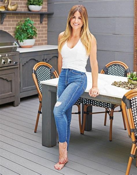 woman sitting   table  front   outdoor kitchen  potted