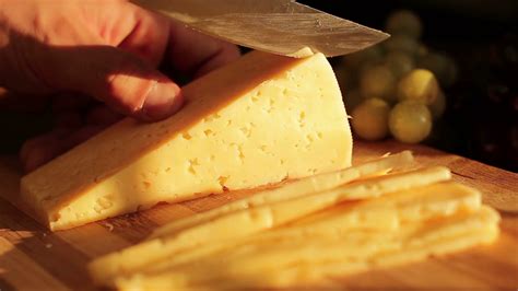 man cutting cheese  cutting board close  stock footage sbv  storyblocks