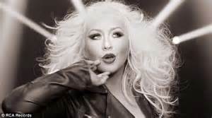 christina aguilera shows off her smaller figure but bigger hair in pitbull s new video daily