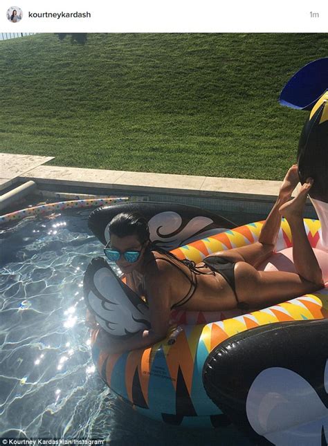 kourtney kardashian shows off her bikini body as she takes a dip in the