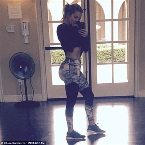 Khloe Kardashian Flashes Flat Stomach And Curvy Derriere