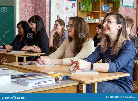 Adults In School Class Sit At Their Desks Editorial Photography