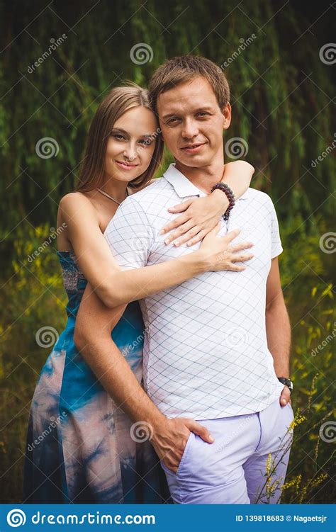 Pregnant Woman With Her Husband In The Park Stock Image