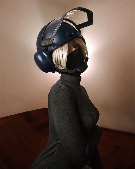 woman wearing  helmet  mask  top   head