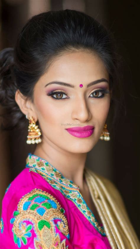 photo of indian girl wearing bindi and fuschia lipstick
