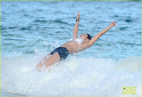 michelle rodriguez shows off her hairy armpits during an ocean swim