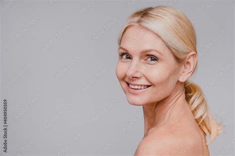 side view portrait of good looking mature blonde woman with clean skin