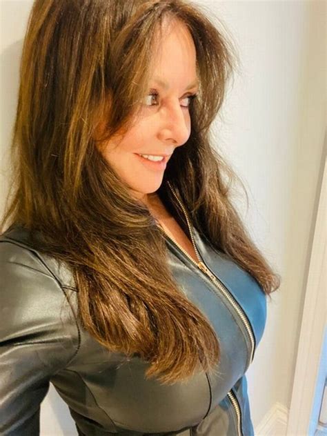carol vorderman flaunts famous curves in risqué leather dress for