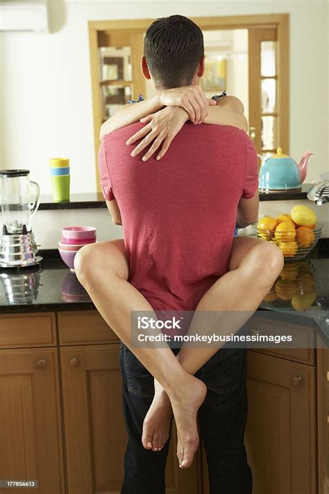 woman hugging  man  legs wrapped   waist stock photo