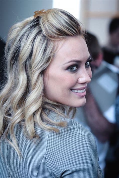 hilary rocks these highlights and pulled back bangs watch