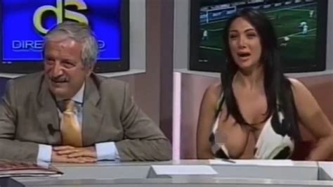 news anchor suffers huge wardrobe malfunction when boob slips out of low cut dress