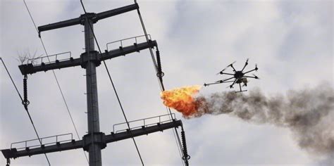 cleaning power lines  easy   flame throwing drone