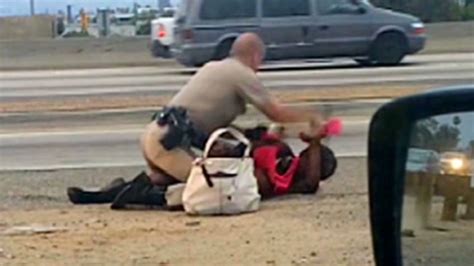 officer caught on camera punching woman video