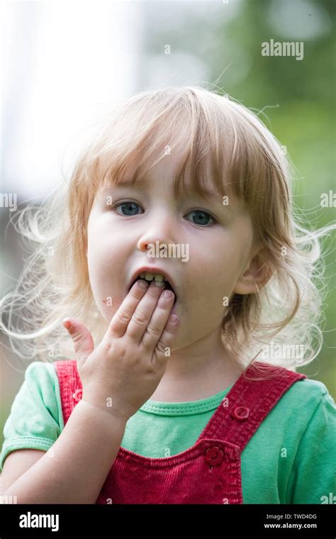 child  open mouth closeup portrait  summer outdoor