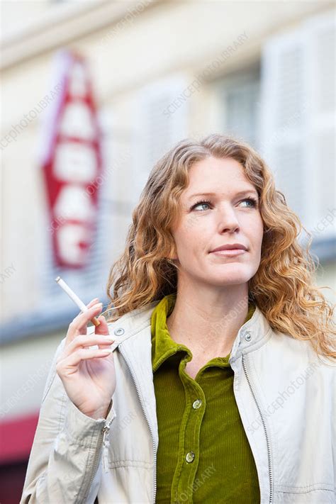 Woman Smoking A Cigarette Stock Image C031 6182 Science Photo Library