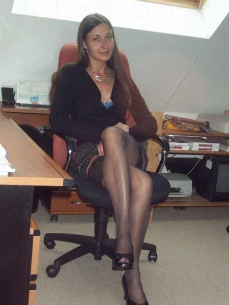 smoking hot office girl with crossed legs and sexy stockings black stockings with high heels