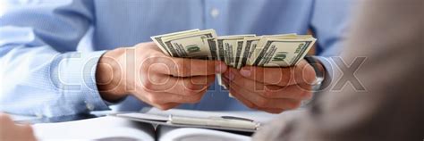 businessman considers cash dollars stock image colourbox