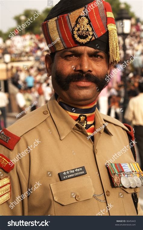 imposing indian soldier  bushy mustache  dress uniform wagah