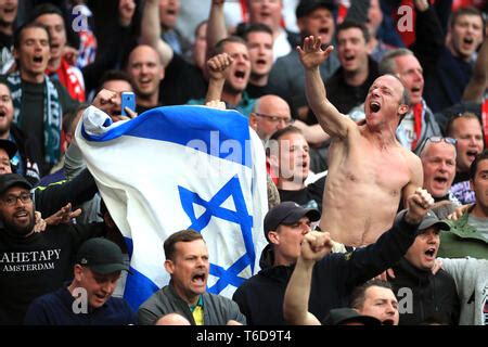 ajax fans hold  israel flag   stands   champions league semi final  leg