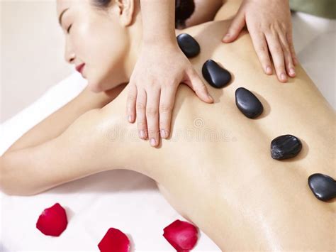 massage of woman in spa salon luxary interior oriental therapy stock