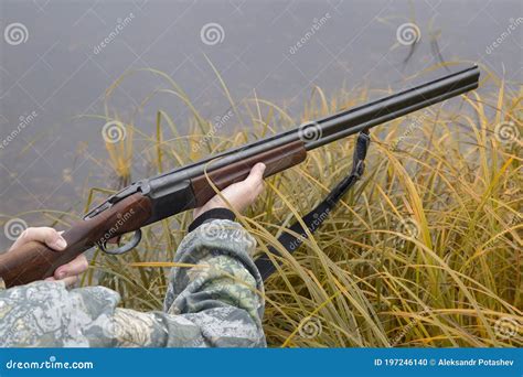 hunter   gun autumn duck hunting stock photo image  camou hunting