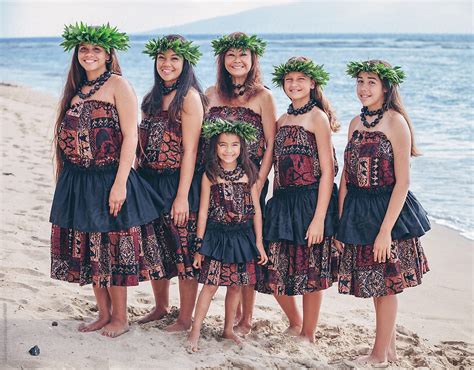 group portrait  traditional hawaiian hula dancers standing   beach  stocksy
