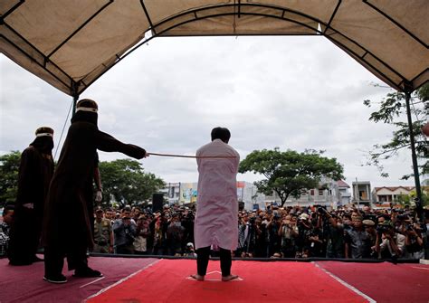 indonesian men caned for gay sex before jeering crowd