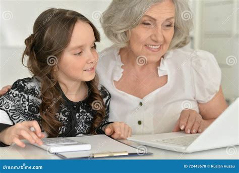 girl making homework  granny stock photo image  friendly