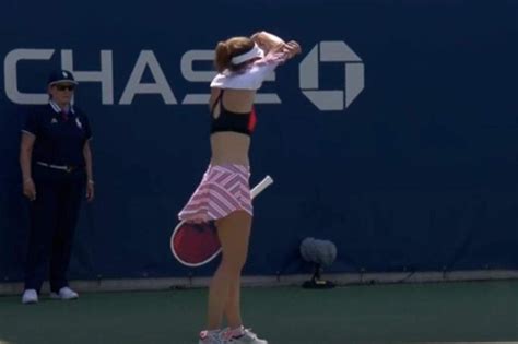 woman tennis player is fined for adjusting top while men