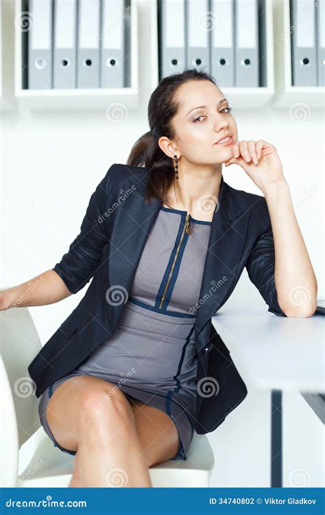 young business woman sitting  desk  office royalty  stock photo