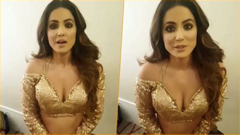hina khan shows off deep cleavage in a sexy golden top watch this hot