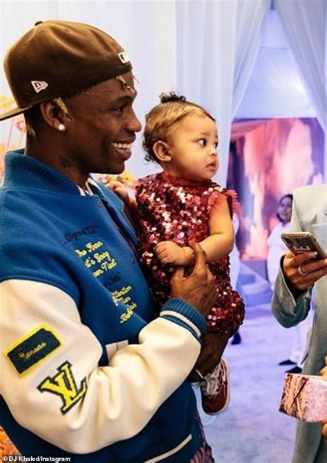 travis scott buys one year old daughter stormi a diamond chain necklace featuring lightning bolt