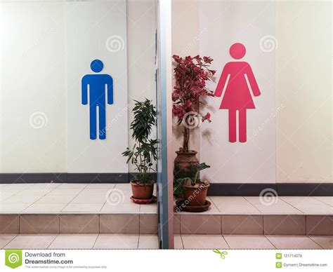 toilet entrance with restroom sign with blue silhouette man symbol and