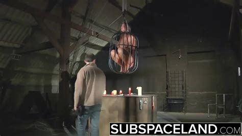 teen trapped in a cage submitted to bondage and bdsm