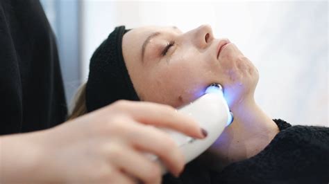 a person is having an ultrasonic facial massage · free