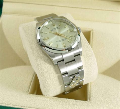 brand  dominos rolex oyster perpetual   silver mm box papers tns diamonds