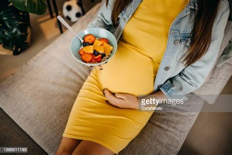 preganant woman eating photos and premium high res pictures getty images